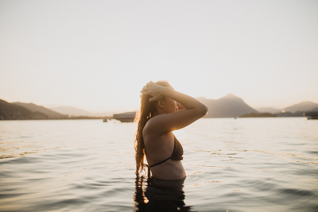 girl in lake at sunrise - early morning - august